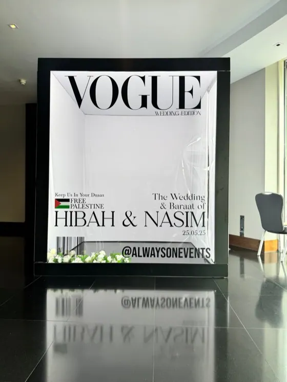 Magazine cover style Vogue photo booth frame at a wedding